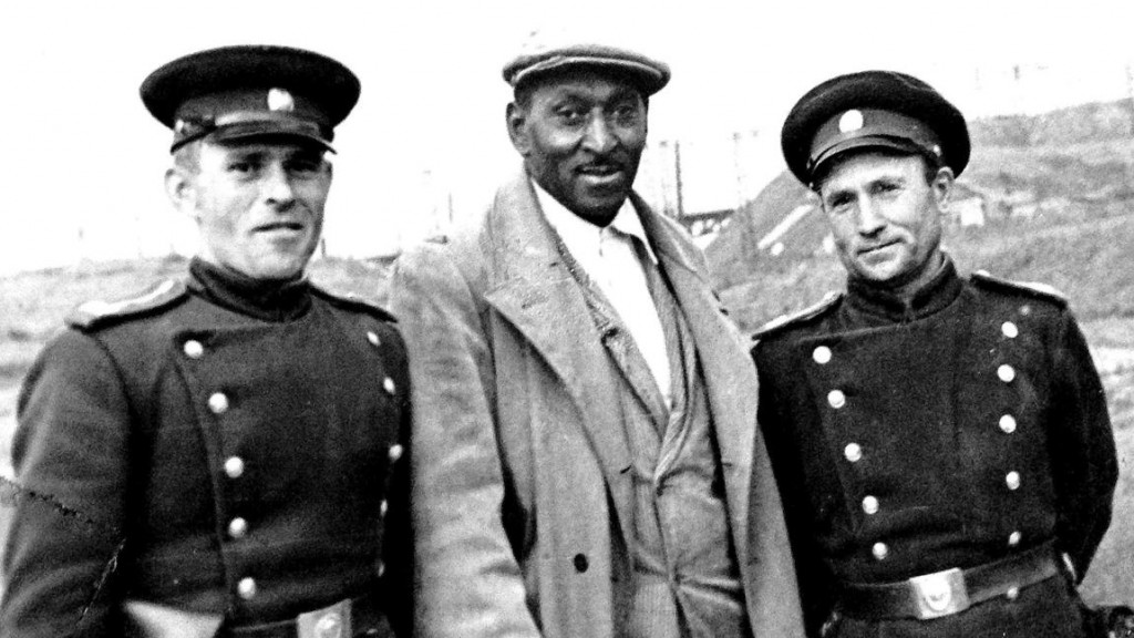 American George Tynes poses with 2 army cadets in Moscow, USSR (now Russia) in 1932. Several hundred African Americans left the US and went to the USSR for work during The Great Depression. Some even ended up staying and becoming Soviet Citizens.