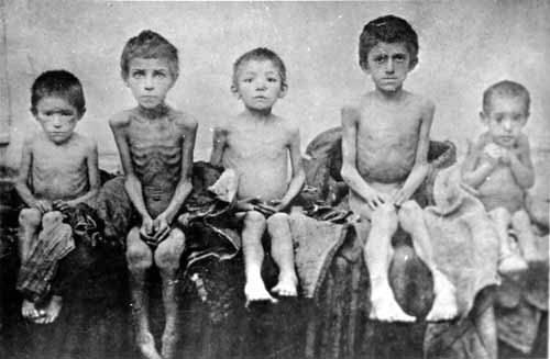 Starving children pose for a picture in Kiev, Ukraine in 1933. This was during the terrible famine known as Holodomor. Between 2 and 10 million people died during this famine. 16 countries have recognized this as a genocide by the Stalin regime to systematically kill natural Ukranians, which is exactly what they did. The USSR refused foreign aid, and would not supply Ukraine with enough food for its people for over a year. The USSR then took the lands of the dead and settled them over the next 2 years with natural Russians. Some 4 million died as a direct result of the famine, and it is believed another 6 million died from malnutrition and birth defects. That means it is estimated up to half of the famine deaths were children, including all 5 in this picture.