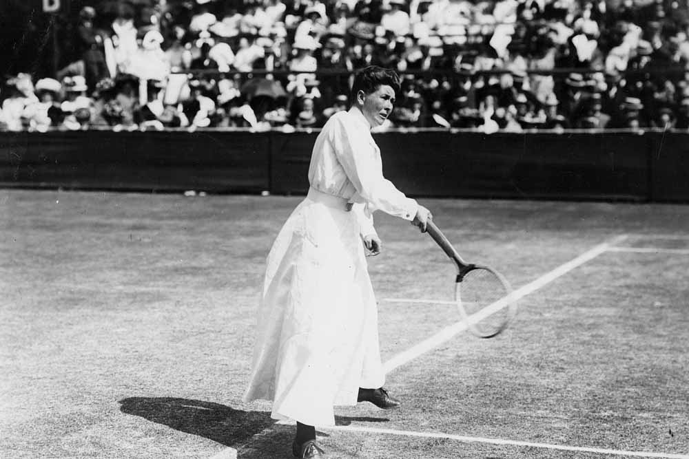 Charlotte Cooper from the UK participating in the first Olympic games that allowed women in Paris, France in 1900. She would go on to be the first women Gold Medalist for tennis. No special shoes or clothes existed for most olympic events, but definitely not for women during the time period. So all female Olympic athletes competed in normal attire in Tennis and Golf in particular.