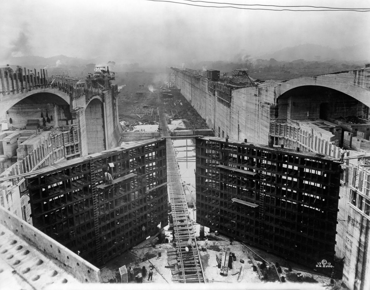 Workers building the locks and tops of the wall of the Panama Canal in 1913. This was near the finishing stages of the Canal, as it would open the following year. Originally a French production which began in 1881, the US took over in 1904 after the French companies operating the Canal went bankrupt. Before they sold the rights to the US, the French spent $275 million US (over $5 Billion today) and only received $40 million to the rights. They also lost 22,000 workers dead from disease and accidents, as well as losing over 800,000 investors their funds in the project. The US finished it in the next 10 years with key modifications, and lost around 5,200 people to disease and accidents. The new country of Panama was created during this time, seceding from Colombia. In fact, the US supported and ensure Panamanian independence away from Colombia by blocking Colombian troops from engaging rebels so the US could barter a more favorable deal with the fledgling nation over building and operating the Canal in 1903.