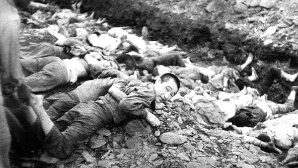 Korean prisoners lay at the edge of a mass grave before being executed in South Korea in 1950.
