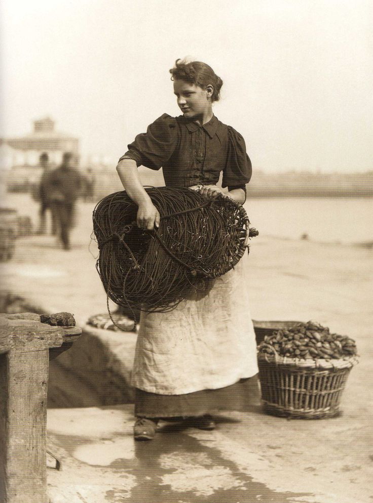 A young woman working as a fisherman in Whitby, England in 1891.