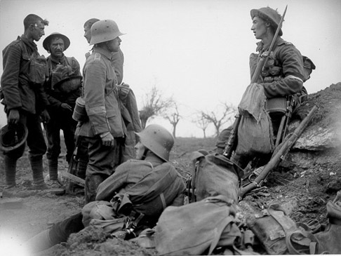British and German soldiers relax during the a truce in 1917. The most prime example was during that first winter of WWI, when the 2 sides put aside their weapons and came together to celebrate Christmas at certain areas of the front. Known as the Christmas Truce, they exchanged gifts, buried the dead in no mans land, and even played a football match. Some of this continued at numerous points throughout the horrific war, where at certain sections, soldiers would ignore their uniforms and parlay for small exchanges.