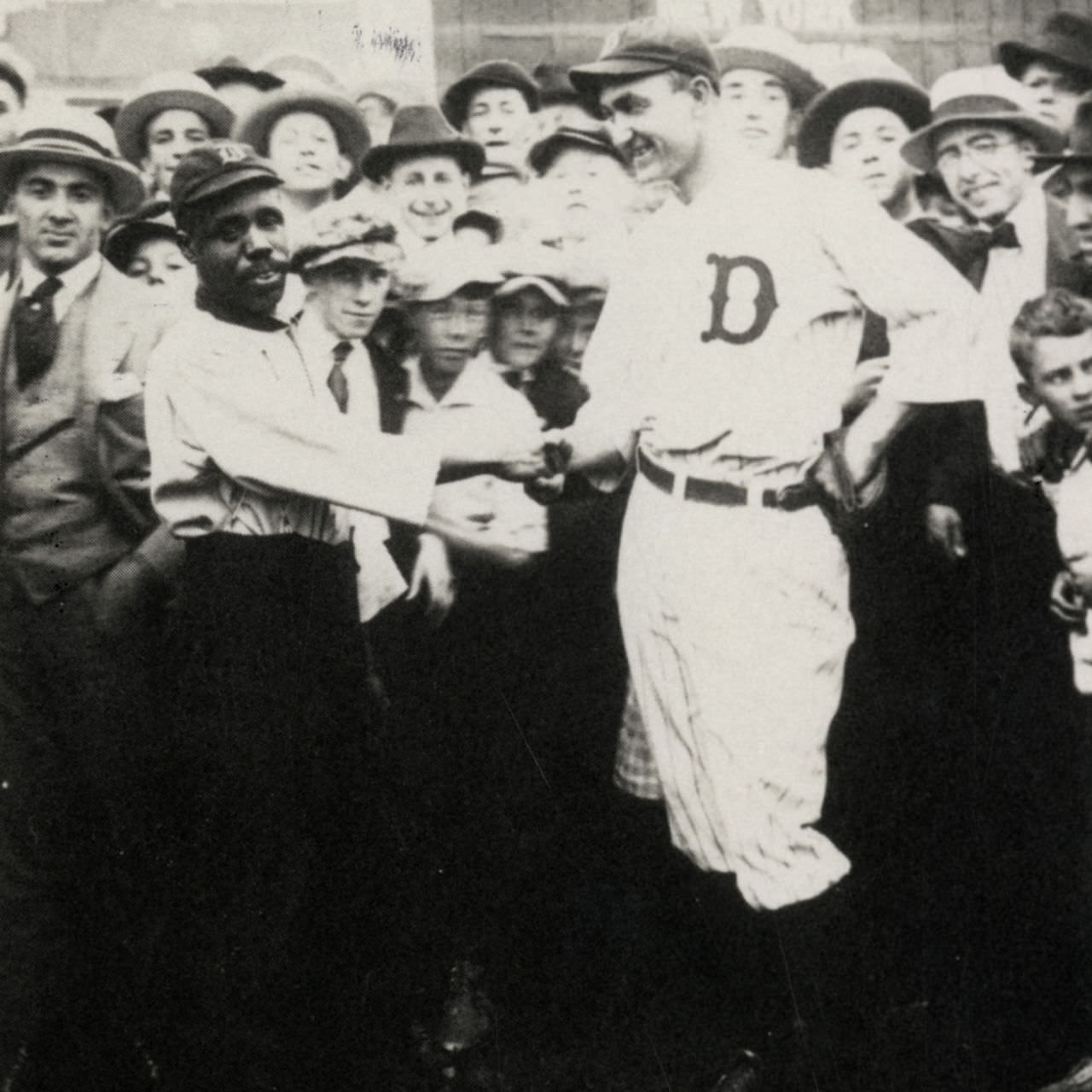 Ty Cobb shakes the hand of the black Detroit Tigers Navin Field assistant Alex Rivers in 1919. Ty Cobb openly supported integration of MLB, and has numerous documented interviews talking respectfully of blacks, but now he is known for his racism.