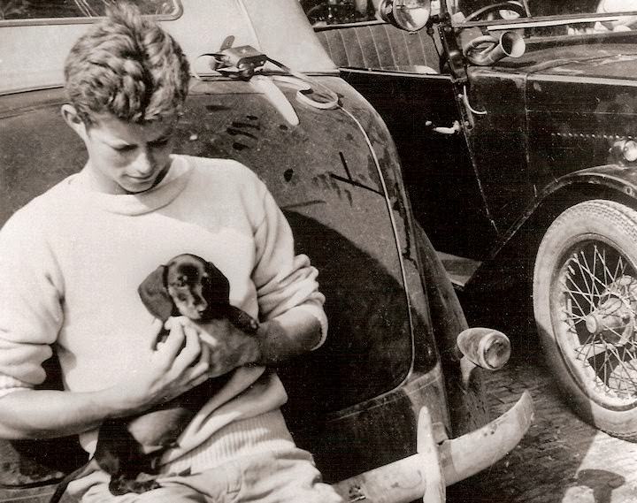 John F Kennedy holding his dog in his late teens in the mid 1930s.