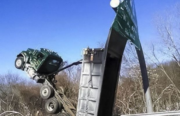 dump truck hits bridge
