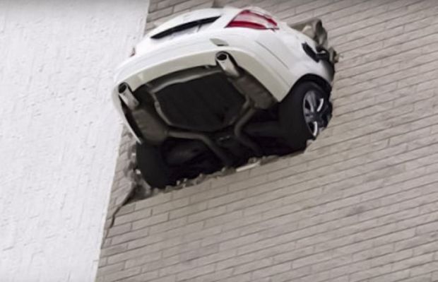 car stuck in wall