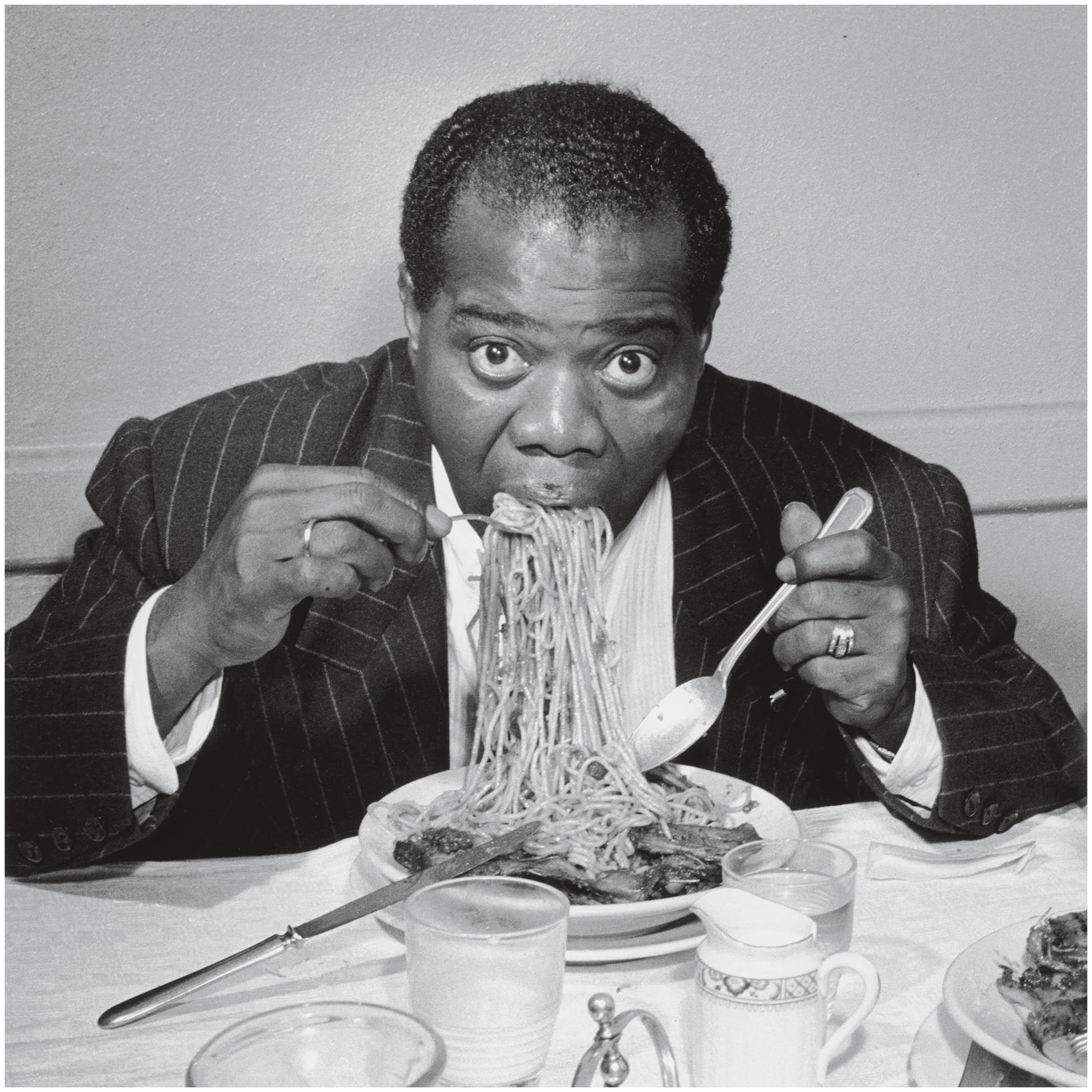 Jazz Legend Louis Armstrong eating spaghetti while in Rome in 1949. His look and playful demeanor along with his immense talent was easily bankable as Jazz blew up in the 1930s and 40s. He toured the world and did duets and shows with many huge stars. He was part of a group of black musicians that would be big name headliners in Jazz clubs that didn't allow black patrons during segregation. Oh and if you didn't know, those clubs would mainly be in Chicago and NYC, not the deep south. He would marry 4 times, but have no children.