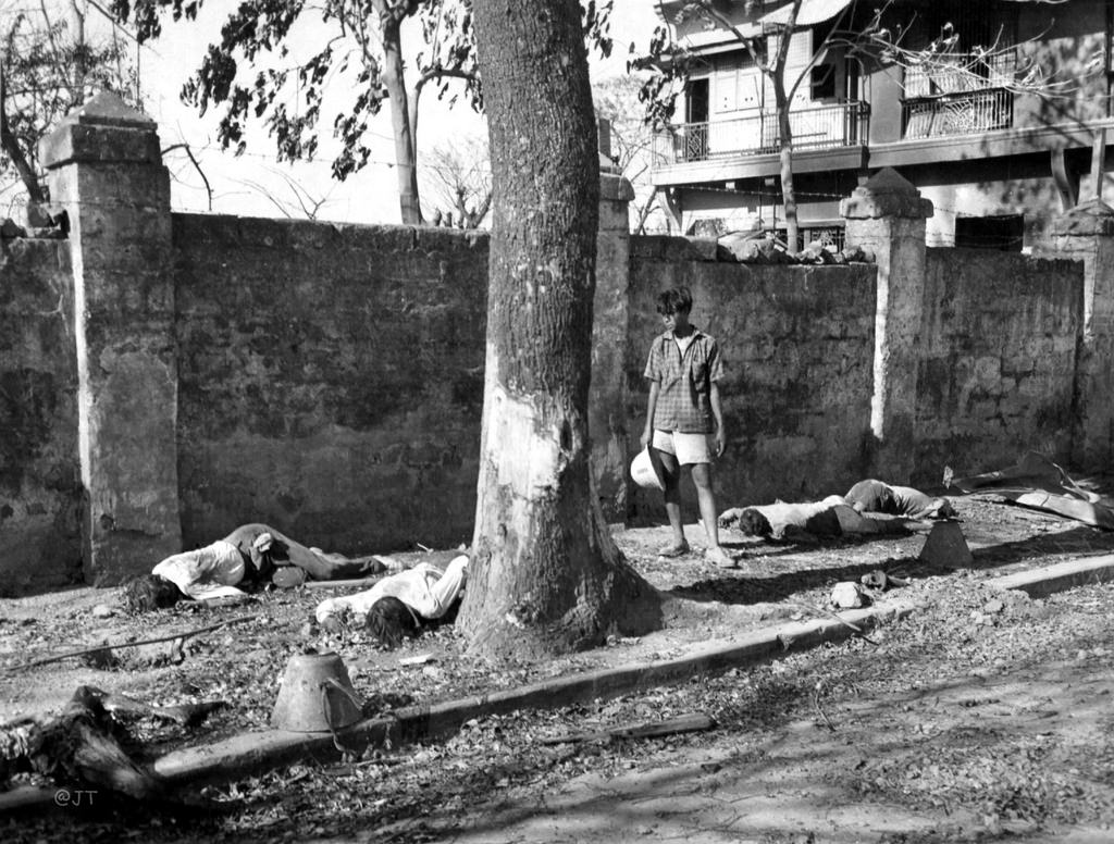 A man looks at murdered civilians during the Battle of Manila in the Philippines in 1945. The 1 month battle to retake the city from Japanese occupation proved costly for the populace, as the Japanese began routinely rounding up males of military age and shooting them. They also put people in concentrated areas as a form of a human shield to avoid artillery, as well as showing no regard for civilians during battles. General Douglas MacArthur did not allow these situations to deter him when he orchestrated his assaults, showing himself no sympathy towards civilian casualties. As a result, up to 240,000 civilians died in this battle. The city at times was full of the bodies of the civilian dead before it was finally liberated and those people could be buried.