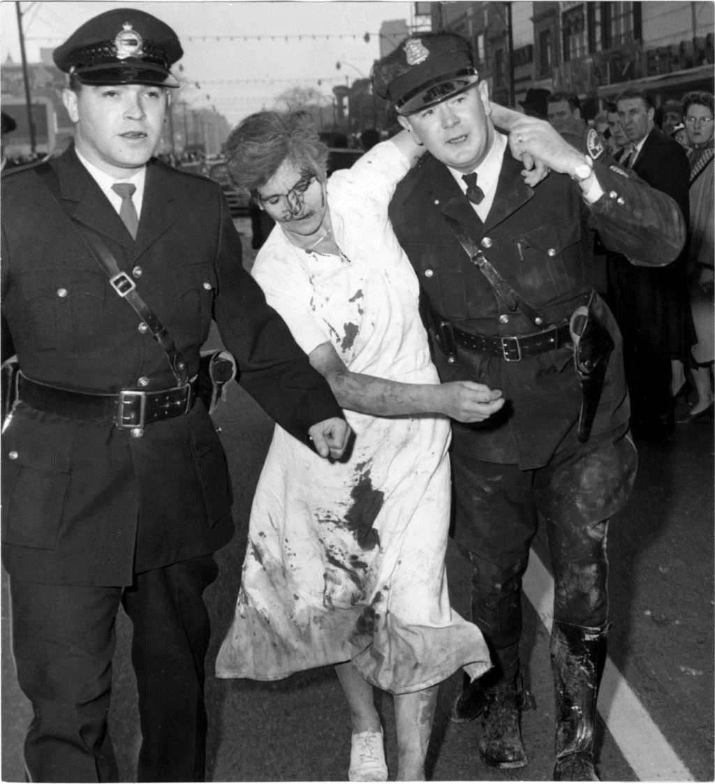 2 Officers help an injured woman after an explosion at a department store in Windsor, Ontario, Canada in 1960. The explosion was caused by a gas leak in the basement, and it blew out the first floor, causing the 2 upper floors to collapse. This disaster killed 10 people, and wounded another 100. The installing company was at fault, and as with most disasters of their time, this could have easily been prevented with either routine maintenance and inspection or proper installation to begin with.