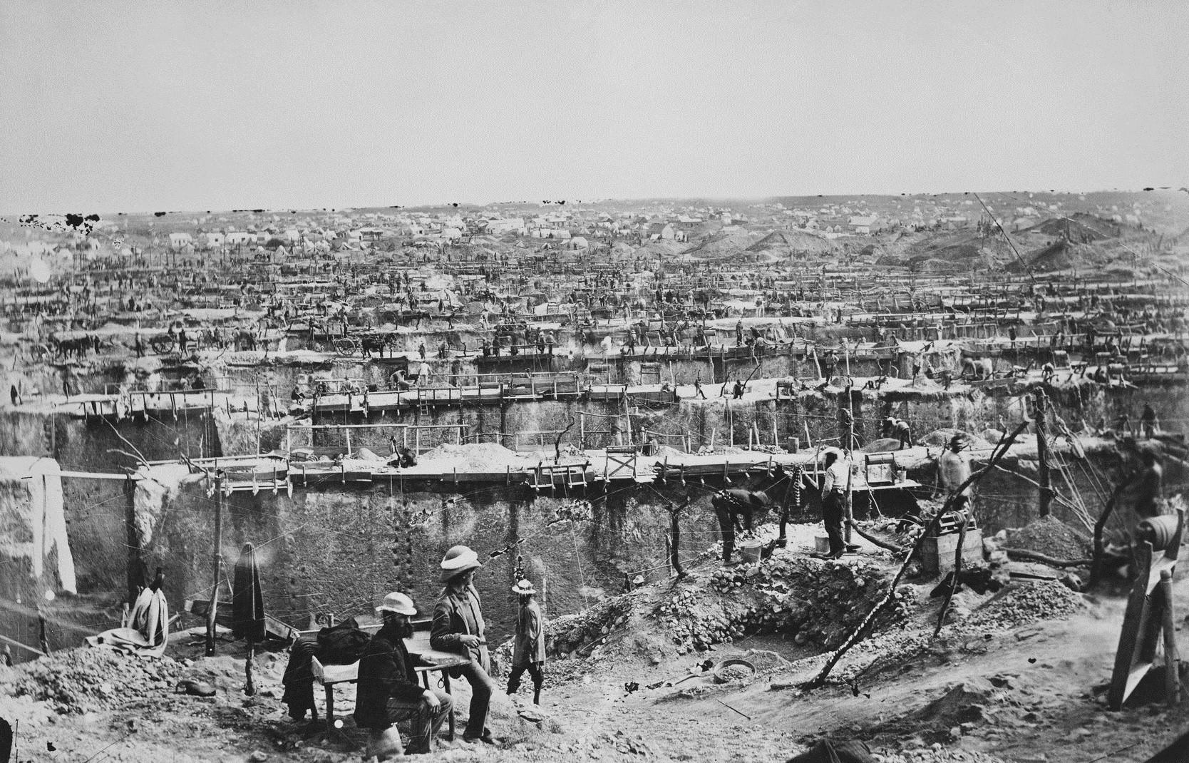 The Kimberley Diamond mine in South Africa in 1872. After a massive 83.5 carat diamond was found here, fortune hunters flocked to the area, with 800 land claims made near the mine. Similar to American gold rush towns, the mines would be heavily worked, and the claims would be bought up by bigger businesses, cutting the workers out of the fortunes of any diamond discoveries. The conditions were poor at times, and workers sometimes died.  In reality, if all the diamonds mined in the last 150 years were on the market, even the top quality ones would cost no more than a nice pair of shoes.