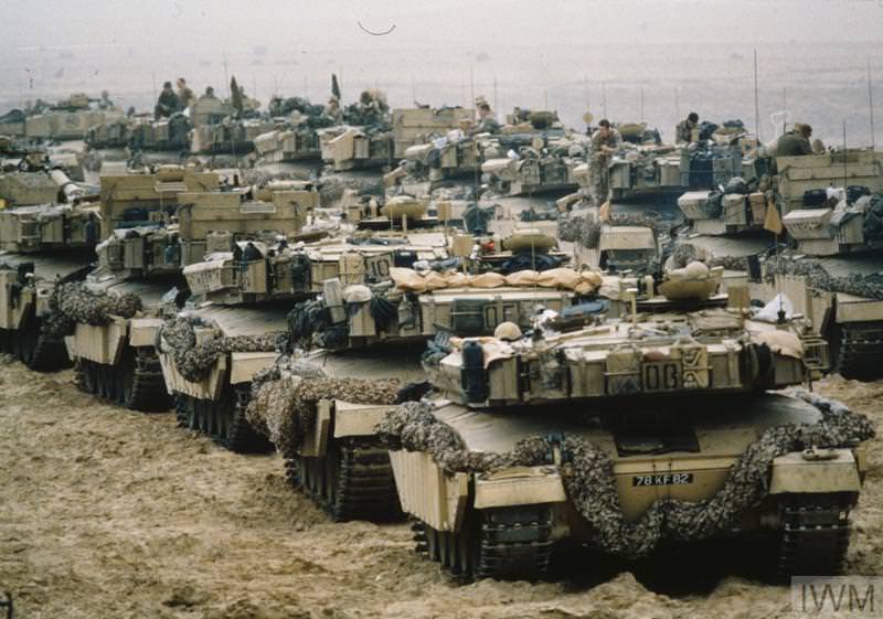 A British Tank column waiting for orders in Kuwait in 1991. The armor the Coalition used was so much superior than the Iraqi's that any tank battle during the Gulf War was utterly 1 sided. The Coalition would destroy hundreds of enemy tanks and vehicles, and wouldn't lose a single piece of armor. After the war, the US in particular left thousands of tanks and trucks in Kuwait. It was cheaper to make them unusable, leave them, and build new ones than transport them back to the US.