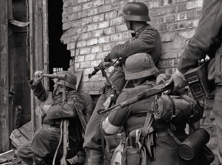 Nazis prepare to enter a building defended by Soviet troops during the Battle of Stalingrad in Russia in 1942. The 5+ month battle was the turning point in the war, as around 2 million casualties totaled on both sides. Over 3.5 million troops participated in the battle. The city was vital for the Germans push to the oil fields south, and had they won the battle could of secured those fields and perhaps have an endless supply of oil, which would of drastically changed the war.