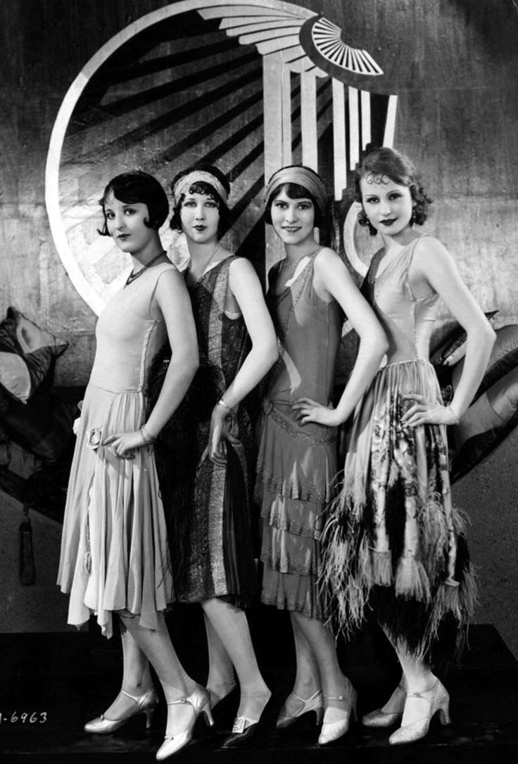 Four Models pose for a picture in Chicago, US in 1920. This fashion style was known as the Flapper Girl style, and was common among young women in the US during the 1920s. This kind of look was common at underground bars and clubs even as prohibition would outlaw such institutions. You also saw such looks in certain silent films as well.