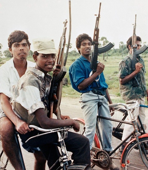 Tamil Tiger rebels patrol the eastern town of Batticaloa in Sri Lanka 1989. This was during the Sri Lankan Civil War which lasted over a brutal 25 years (1983-2009). Most of the rebel groups were young men such as the ones pictured. The rebels were ruthless with their guerilla tactics. During the 1980s in particular, they would attack unsuspecting towns and villages, and massacre everyone, usually numbering in a few hundred. From government officials to average citizens who lived under government rule, they would kill everyone, including women and children. What's worse is they did it in extreme ways. Hanging, using machetes, or straight executions. After the rebels lost, evidence presented for potential war crimes against combatants surfaced. These included pictures of babies shot, young children hung, and all sorts of innocence hacked to bits surfaced. Over 100,000 civilians were killed during the war. To put the massacres and brutality in perspective, only around 50,000 soldiers died during the war.