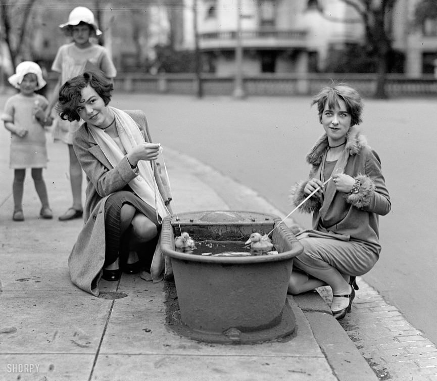 Women in Washington, D.C. bathe their pet ducklings, 1927.