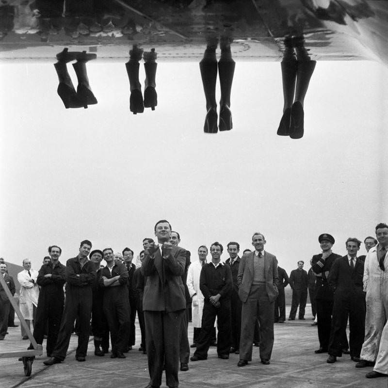 Miss World contestants in 1953, on the wing of an airplane (look at all their faces, they're so happy!)