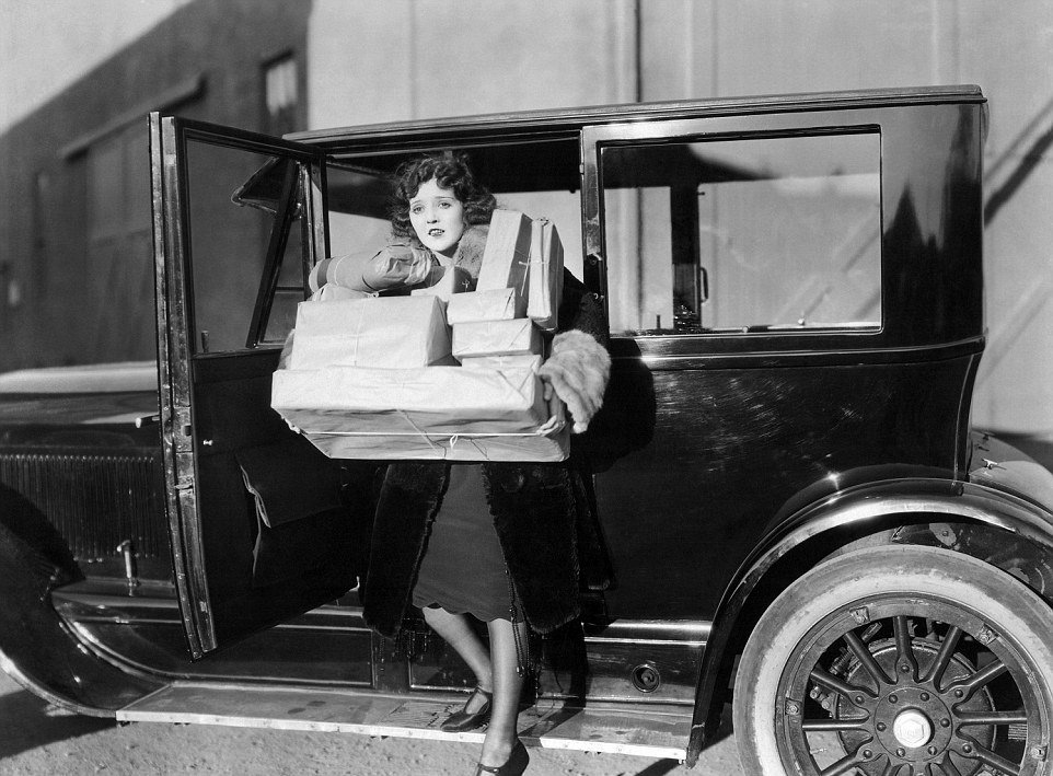 Actress Doris May has her picture taken after doing Christmas shopping in 1921.