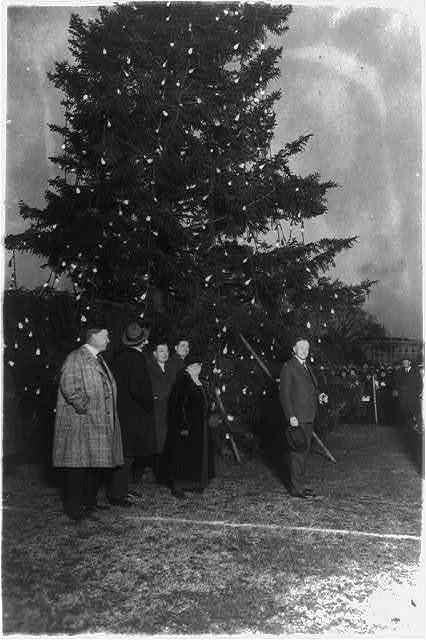 US President Calvin Coolidge illuminating the community Christmas tree, which has been erected on the Monument Grounds, south of the White House in Washington D.C., US in 1923.