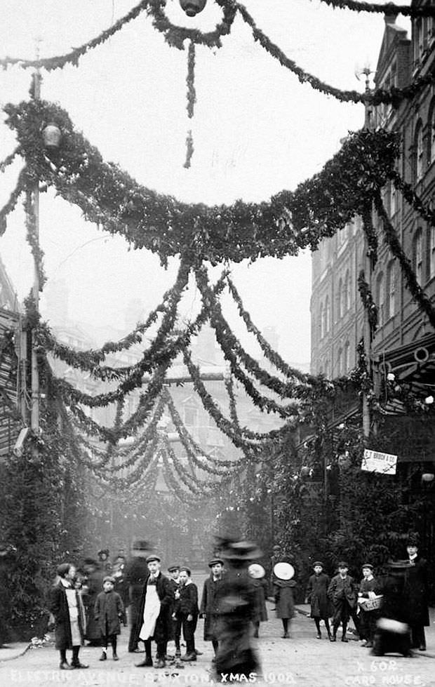 Street decorations for Christmas in London, England in 1908.