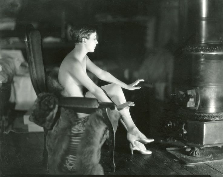 Bessie Love posing for a photo shoot by James Abbe in Paris, France in 1928. Bessie Love was an American silent film star, doing her first work at just 18 in 1916. Towards the end of silent films, Hollywood pushed the limits of sexuality in their films, with mostly just shoulders and legs exposed, but also sheer outfits. Actresses such as Bessie Love also did promotional photo shoots which exposed far more than the films they did. Many photo shoots would show cleavage, be semi nude, or nude in general, where such sights weren't in American films themselves until the late 1960s. Some pictures would be marketed in Europe, in France in particular, to promote American film stars. Other stars and their sexy photo shoots rarely made it to the public. It was a relatively unknown but not that uncommon aspect of early Hollywood and some of the female stars.