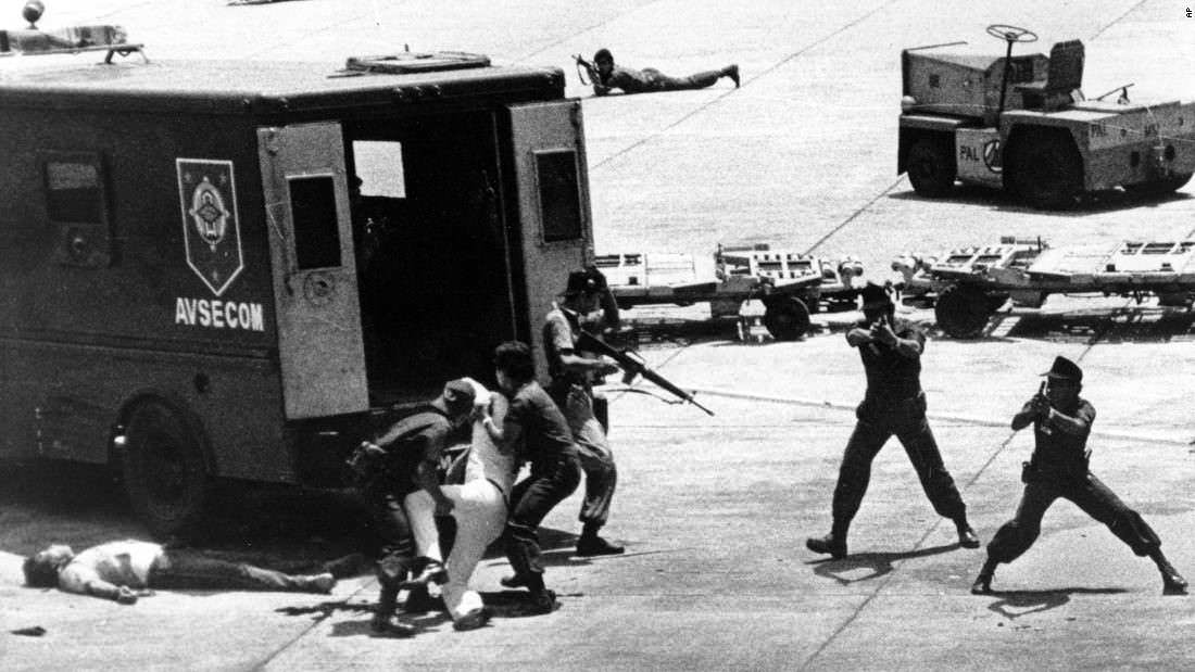 This is the reaction of the surrounding soldiers after the assassination of Benigno Aquino Jr. at the Manila Airport in Manila, Philippines in 1983. The exiled former senator had just returned in an attempt to run for president. Almost immediately after getting off the plane, the assassin walked up to him and shot him in the head. The assassin was killed instantly afterwards. President Ferdinand Marcos was blamed, and this event turned a relatively small movement against Marcos into a big one, and just 3 years later Aquino's wife ran against Marcos. Marcos won under suspicious circumstances and was accused of fraud. The country agreed, and felt he cheated, rose against him, and forced him into exile, drastically changing the political shape of the Philippines.