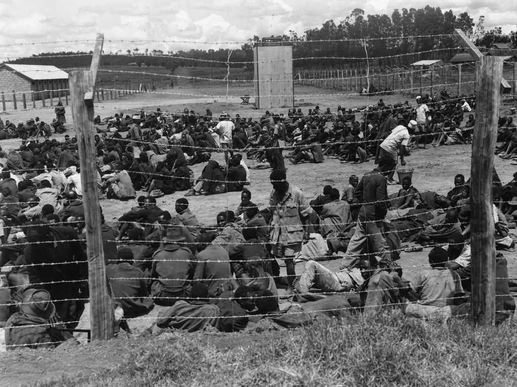 This is a prison camp in Kenya during the Mau Mau Uprising in 1956. The British started rounding up every suspected member of the Mau Mau and placing them in work camps. Men, women, children, they would round them all up, but did not have the manpower to properly feed and interrogate these people. Not long after the uprising began and people were rounded up did the people in the camps have outbreaks of diseases and also began to starve. Officially, the British killed around 12,000 in the fighting, and some 20,000 others dying in the camps. However a nationwide census in 1962 found up to 300,000 Kenyan people missing, possibly all killed.