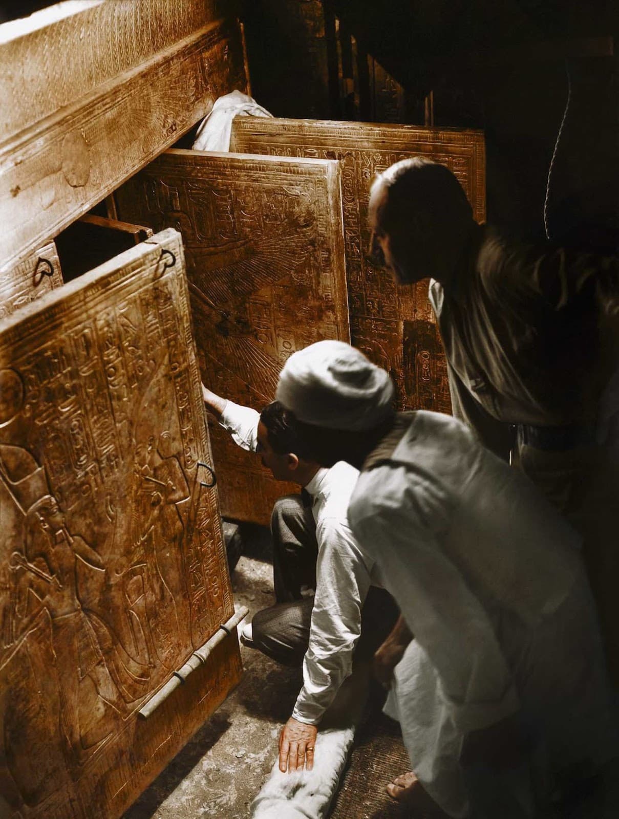 Howard Carter, Arthur Callender, and an unidentified Egyptian worker open the inner chamber and see King Tut’s sarcophagus for the first time
