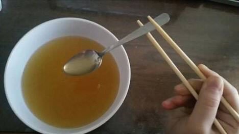 eating soup with chopsticks