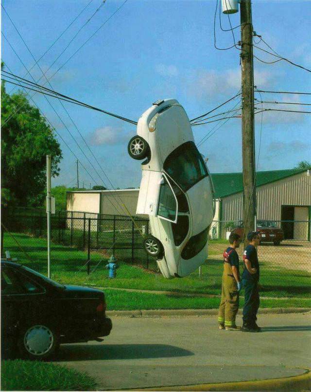 wtf car hanging on power lines