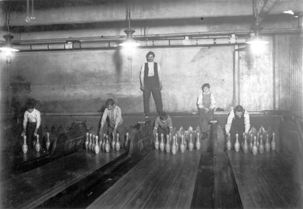 Young boys known as Pinsetters working at a bowling alley in Chicago, US in 1908. Many business owners actually hired children to do tedious jobs for incredibly low wages. Factories in particular exploited children. But many forget that even owners of games, shows, and sports hired children. Ballboys and girls in all sports is another example, which started as overused children working a low paying job but did eventually evolve to respected and even desired jobs for children today. Interesting note, Pinsetters existed easily into the 1950s before mechanized alleys took over.