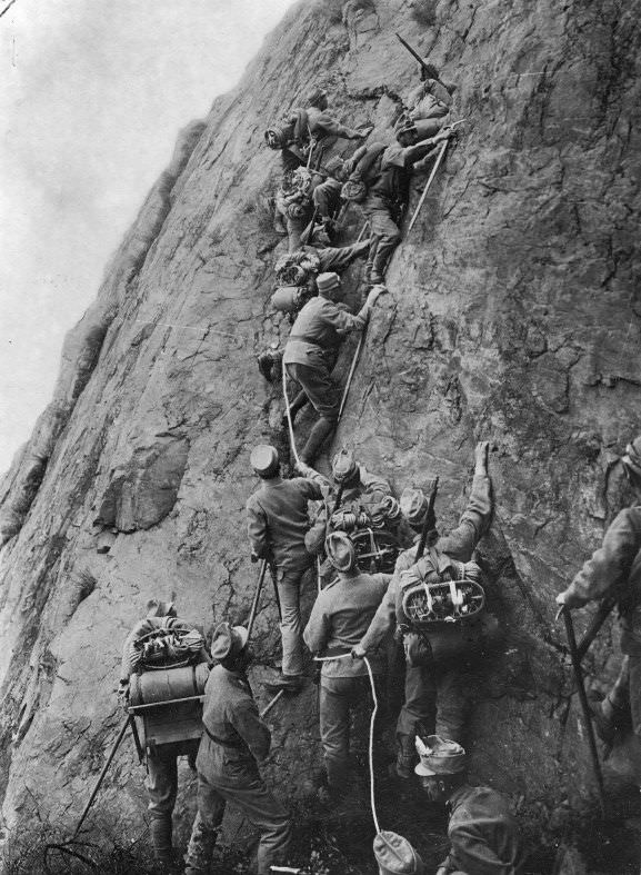 An Italian Alpine Unit scales a cliff during the Italian Campaign (or Mountain War) in 1915. During WWI, the Italians were on the allies side, and used these units to get over mountains and cliffs to create a second front against Austro-Hungary. The mountains are in Northern Italy, and posed a natural border. Moving units over them rather than around them helped the Italians gain some ground on their enemy. WWI had many different campaigns and fronts, causing different methods to maneuver in order to possibly flank an enemy. The Italians going over mountains on foot though is often forgotten.