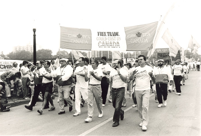 Protesters march against free trade negotiations between Canadian Prime Minister Brian Mulroney and US President Ronald Reagan in Toronto, Canada in 1985. As Japanese products became cheaper and superior to their US counterparts in the 1980s, the US began to suffer economically, especially with jobs in electronics and cars, causing factories to shut down and inflation throughout North America. Canada had higher inflation rates, and fears of their own issues arose. After Mulroney and Reagan opened talks to free trade across North America, fears persisted on what Canadians would lose to help the US regain its own losses. Thousands of Canadians made many protest marches, but eventually an agreement was struck in 1987 between the 2 countries and went into effect in 1988, known as the Canada–United States Free Trade Agreement (CUSFTA).