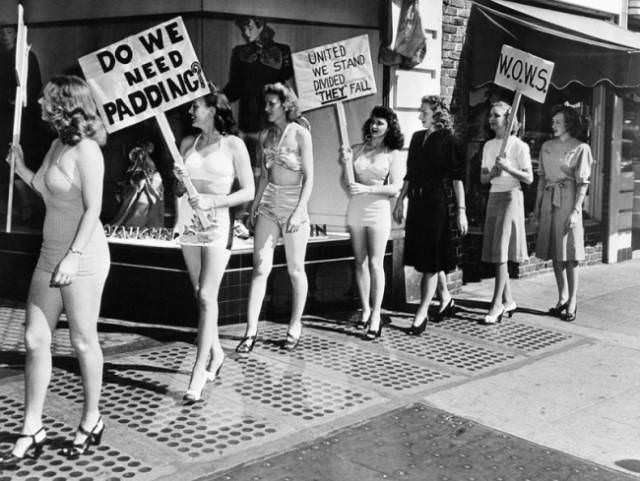 Members of the “Women’s Organization to War on Styles” picketed a dress shop in protest of longer skirts and padded hips. (California, 1947)