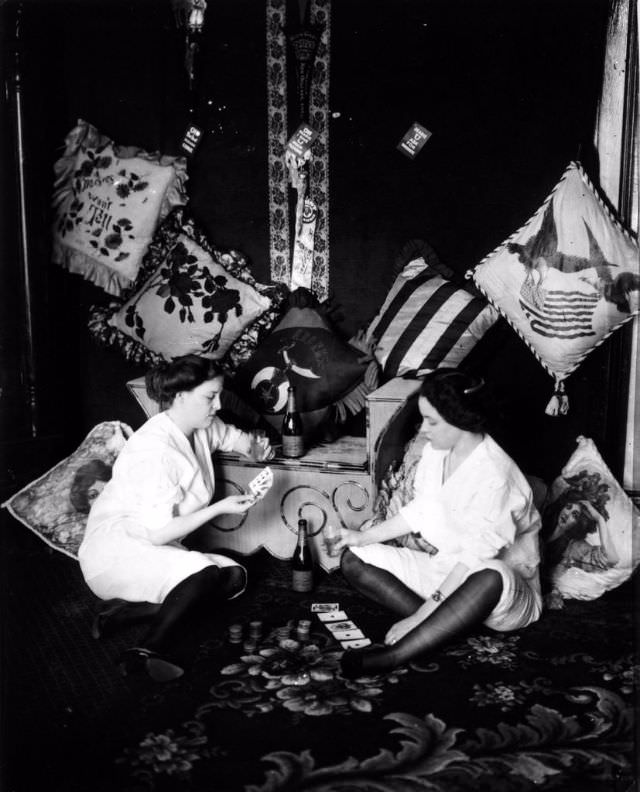 Prostitutes play cards and drink between clients in a brothel in New Orleans, US in 1912. Prostitution was fairly common across the US up until the women's movement in the US in the early 1900s. Eventually, every state outlawed it. Once they became a state, only Nevada would eventually allow it. As with any service job, much of an average day can consist of no activity. Alcohol and gambling, also legal at the time, could take up much of a prostitutes free time. Whats also interesting is it was not uncommon for a frequent customer to marry a prostitute, and possibly the prostitute would still work despite being married. One of the most famous example of this situation is Wyatt Earp and 2 of his brothers who all either married or had extended relationships with prostitutes.
