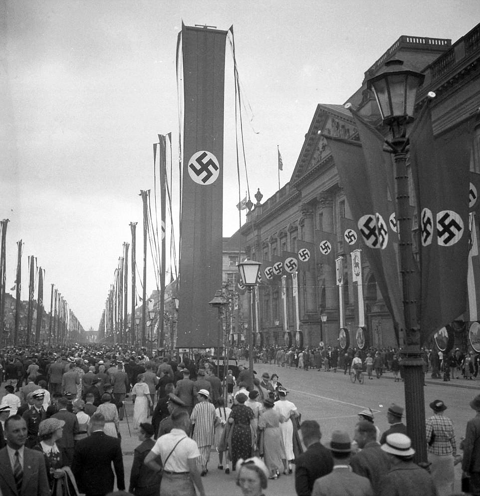 People head to see the Olympics in Berlin, Germany in 1936. Germany won the rights to host the games in 1931 and The Third Reich planned it to be the greatest public event in history at that time. Other countries even considered boycotted the games fearful of what Germany would do with their propaganda if they did well at the games. Hitler even had the event broadcasted for the first time, with the most powerful signal ever sent into space at that time. It was a display of power and wealth from the rebuilt German economy.