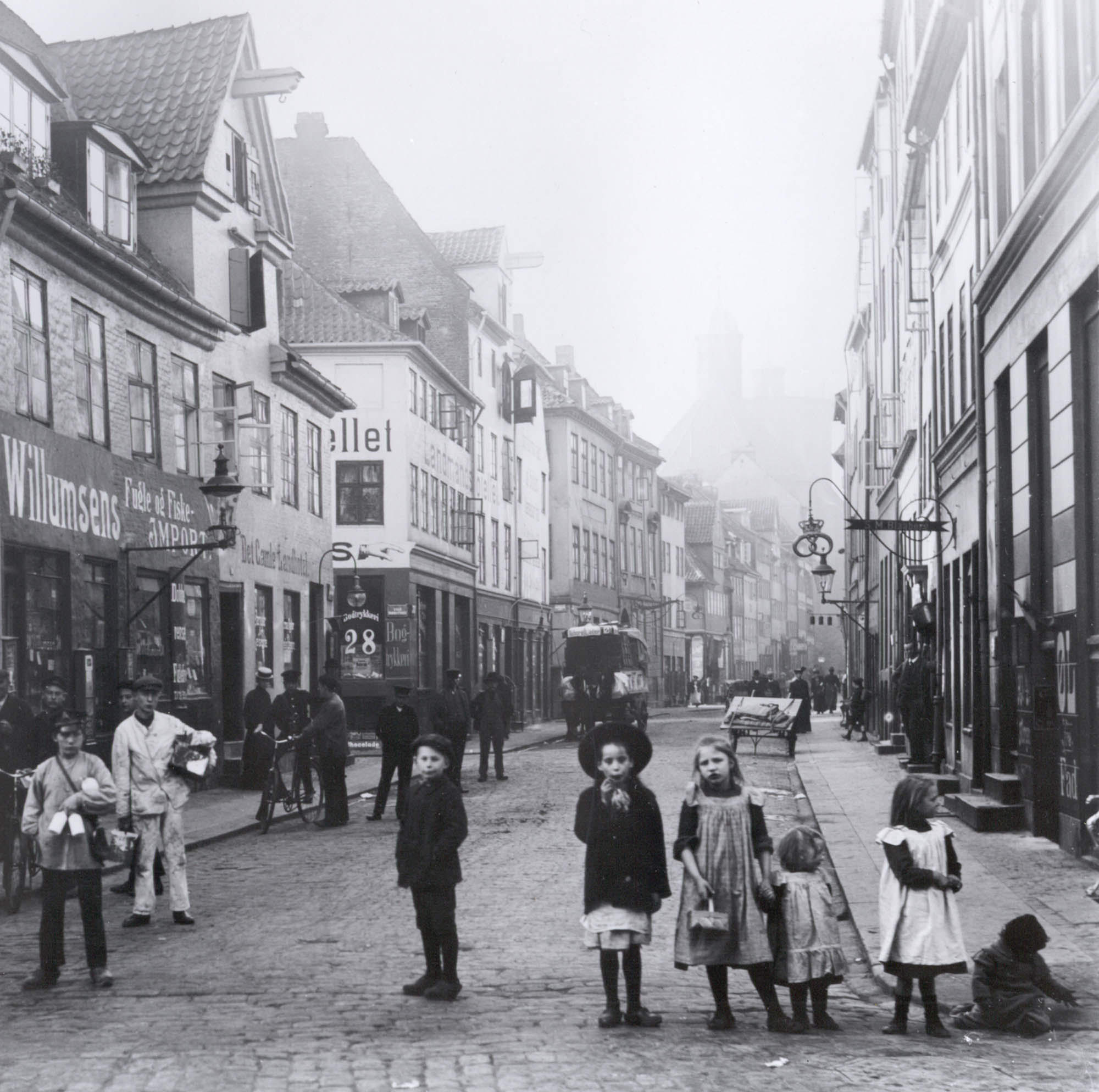 A street in Copenhagen, Denmark in 1900. It's interesting that the entire street posed for the picture, even from considerable distance in the background.