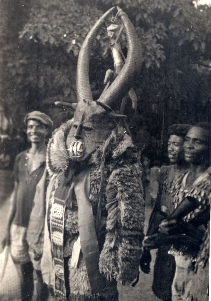 A man wearing an Agaba mask in Achalla, Nigeria in 1946. This was part of a traditional dance from the local tribe in the area that had been around for thousands of years. The mask itself could be hundreds of years old, as many African tribes had masks, often reusing them for ceremonies. They have become collectible antiques from westerners. This one is one of the more detailed and scarier ones.