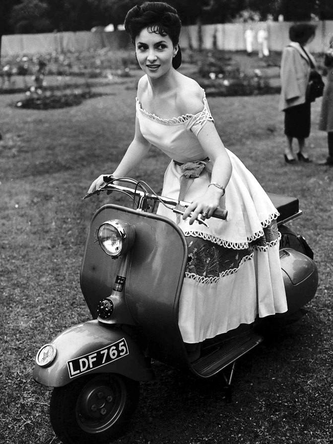 Taking a scooter for a ride in 1950.