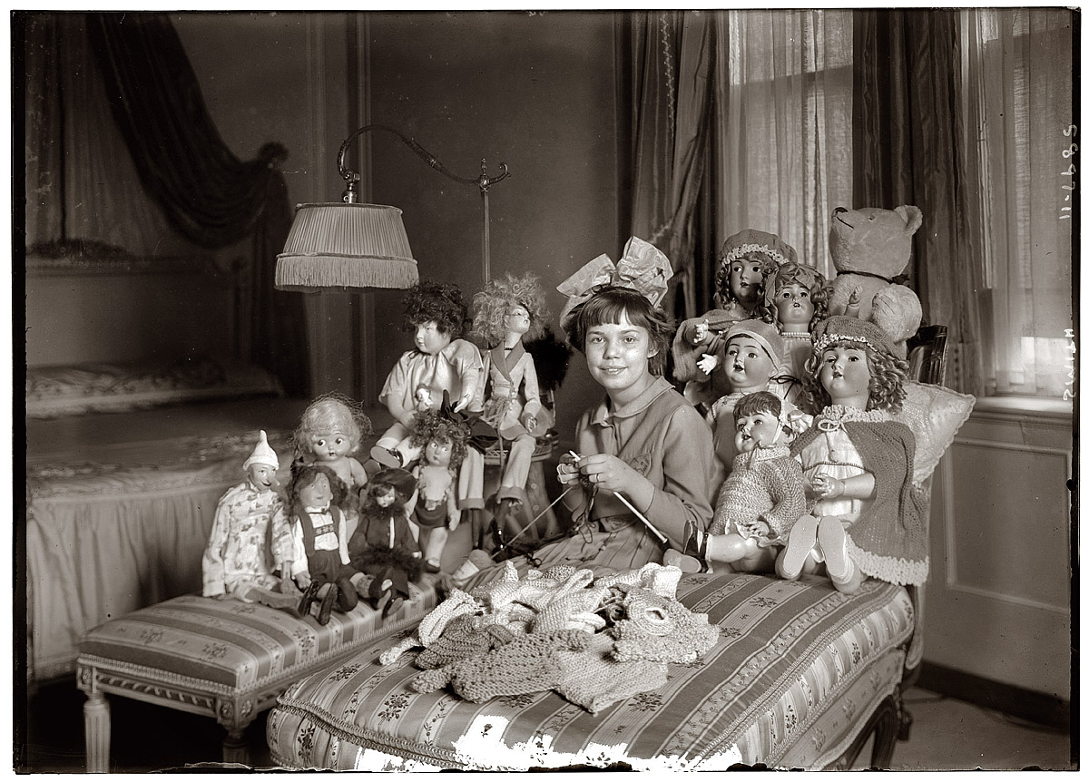 Girl with her dolls in 1931.