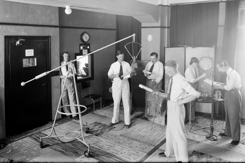 A radio broadcast show complete with scripts and sound effects in 1932.