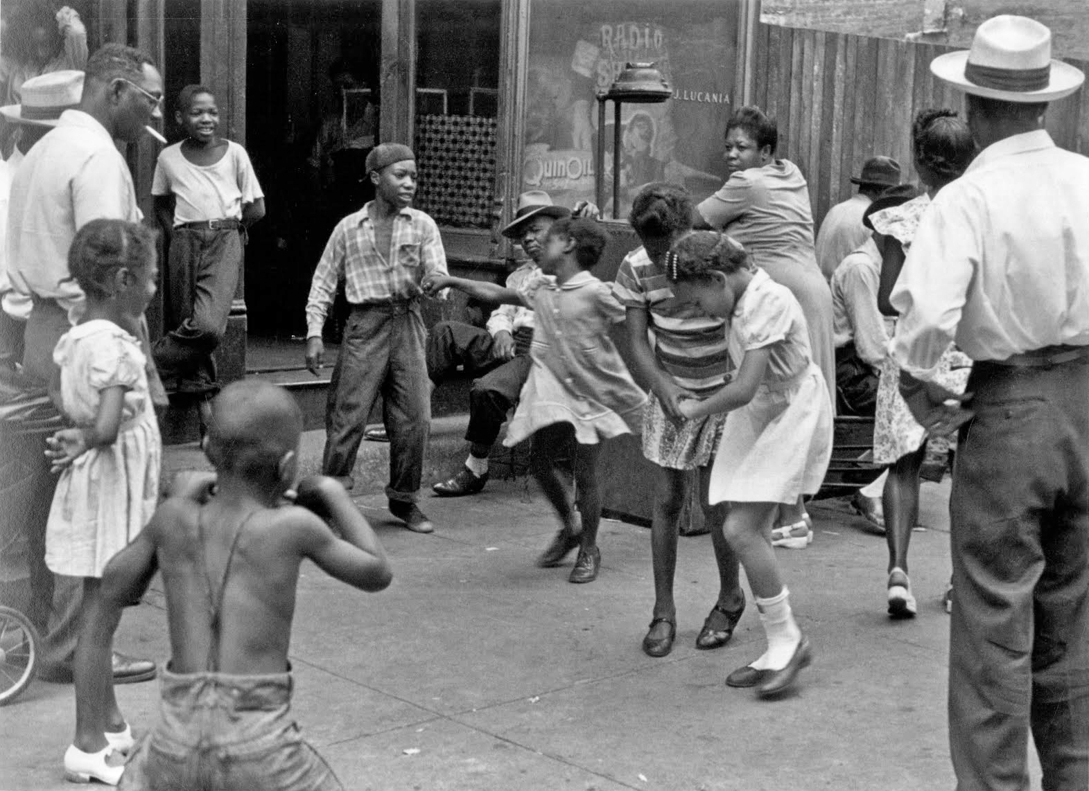 Children dancing in the street in 1947.