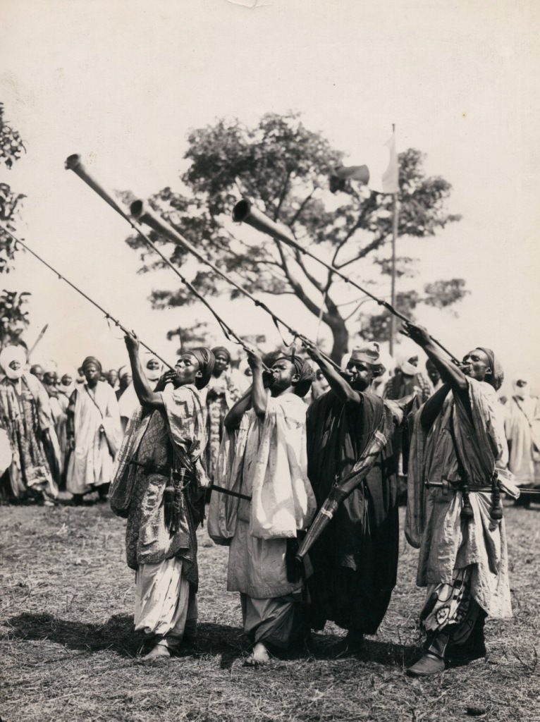 A West African tribe sounding their horns, 1896.