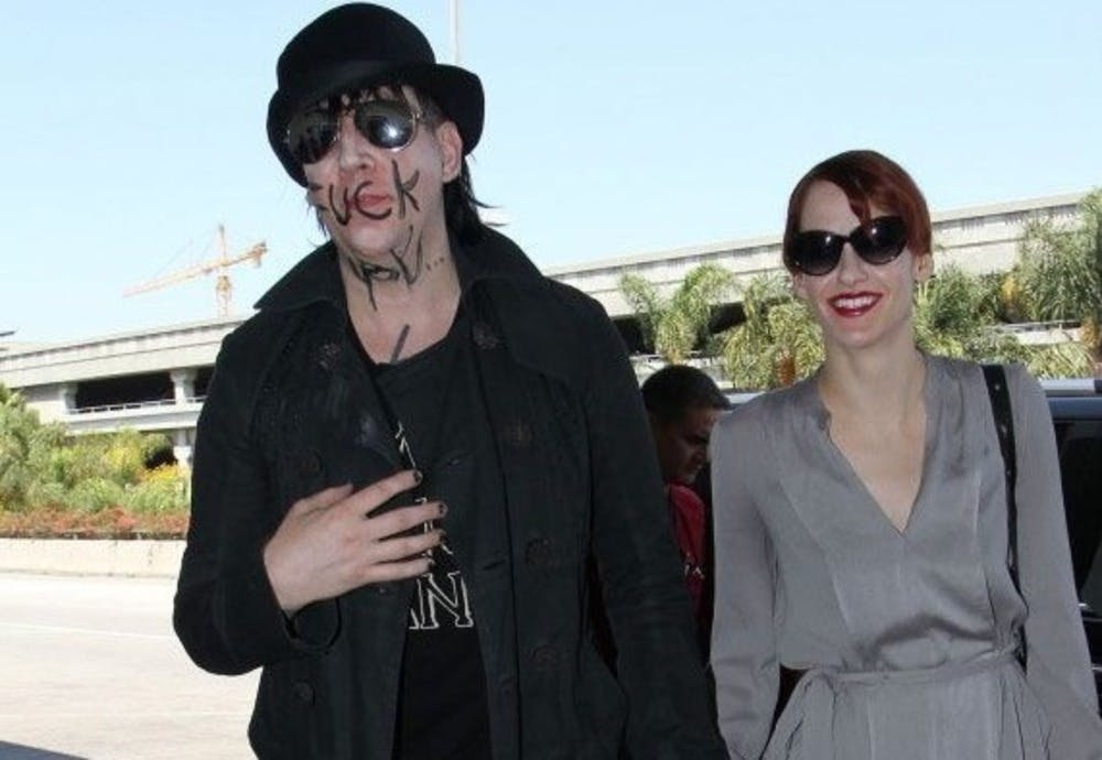 Marilyn Manson wrote "Fuck you" on his face. He told bystanders it's not to them and covered the message around children, the photos weren't worth publishing.