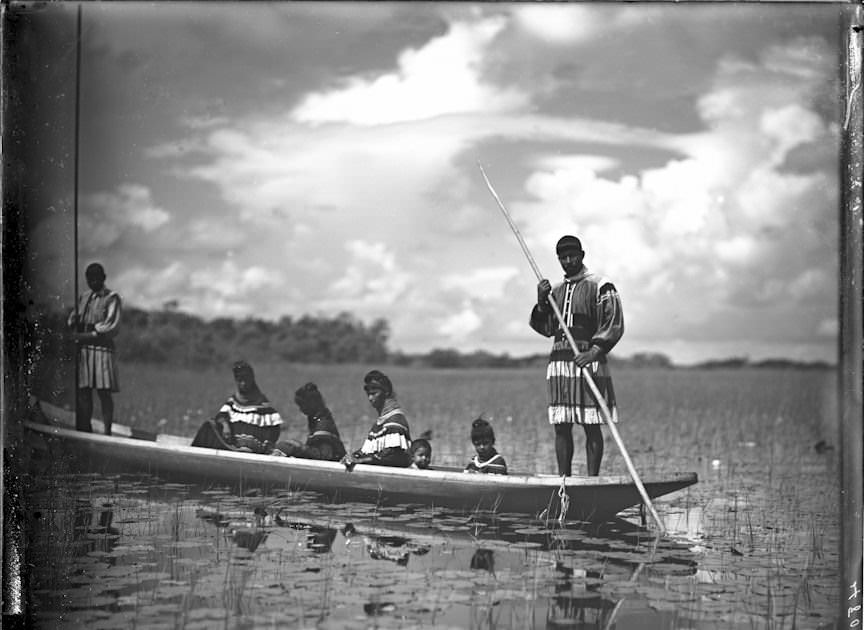 Miami John Tiger with his family in a canoe in the Everglades, Florida, US in 1910.