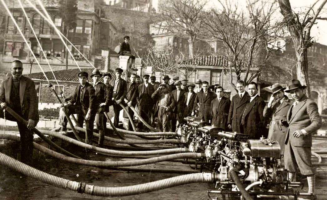 Firefighters and city employees examine a new water pumping system in Istanbul, Turkey in 1931.