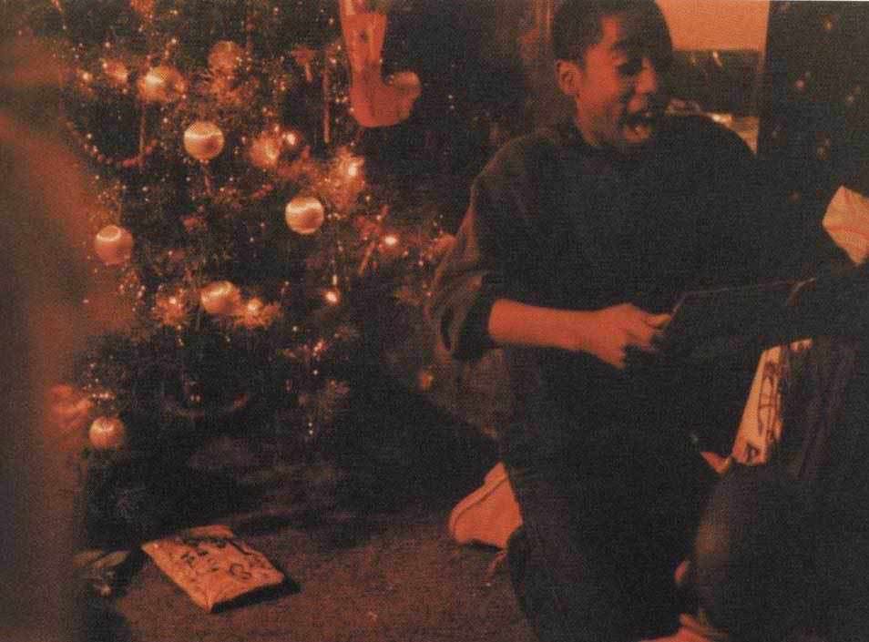 Tupac opening Christmas presents.