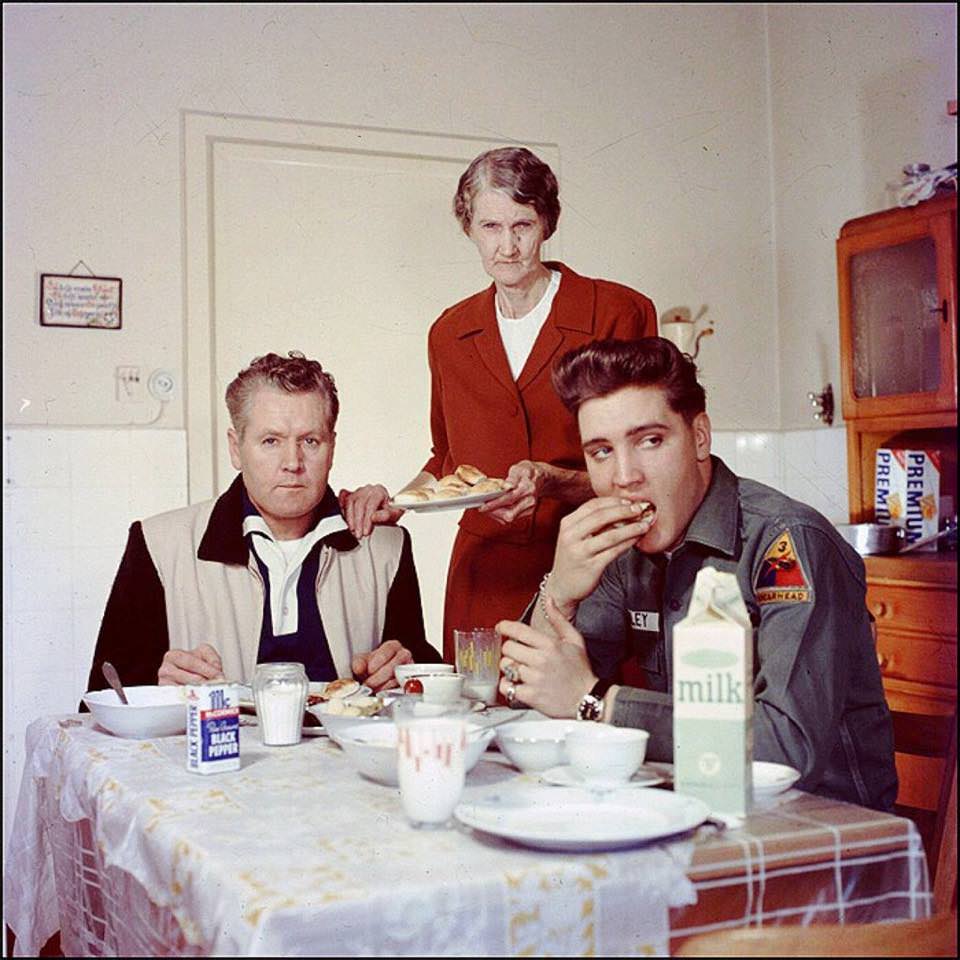 Elvis Presley with his folks.