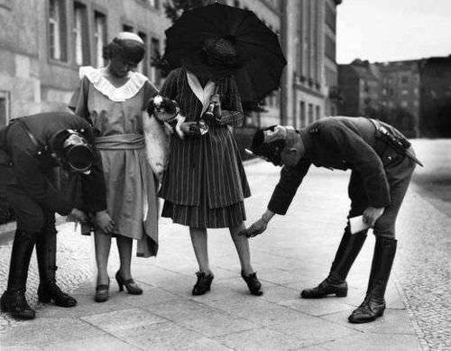 Police checking the length of dresses in Berlin in 1922.