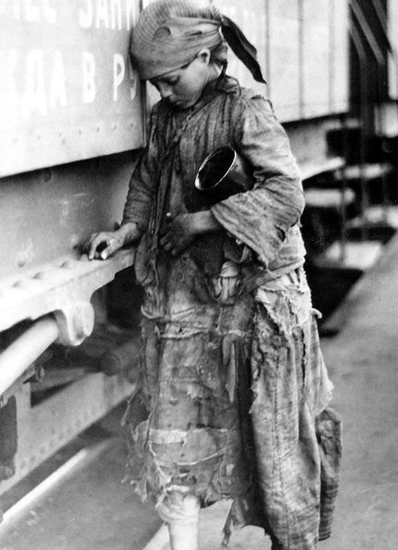 A young starving girl begs at a train station in Saratov, Russia in 1920.